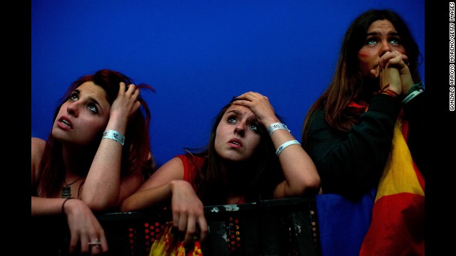 Supporters of Spain watch in Madrid as their team loses 2-0 to Chile on June 18.