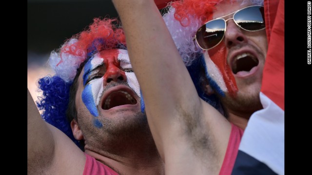 Supporters of the Costa Rican soccer team cheer before their game against Uruguay on Saturday, June 14. Costa Rica upset Uruguay 3-1.