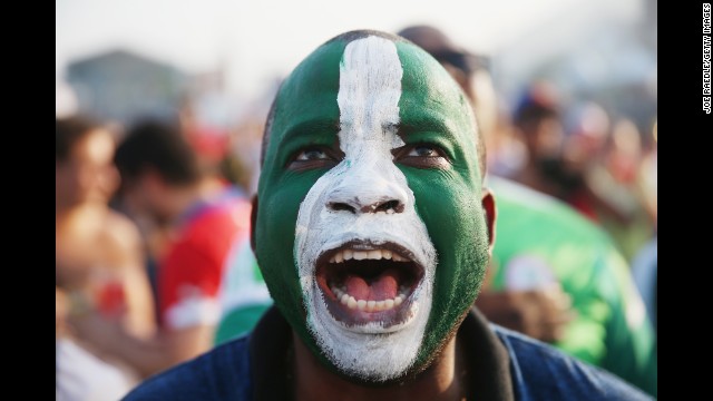 A Nigeria supporter watches his team play against Iran on June 16. It ended 0-0.