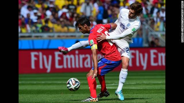 England midfielder Adam Lallana, right, vies for the ball against Costa Rica forward Bryan Ruiz. 