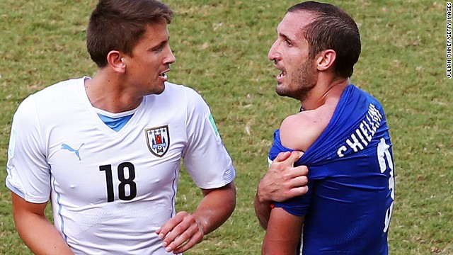 Chiellini attempts to show the referee the mark left by Suarez's alleged bite.