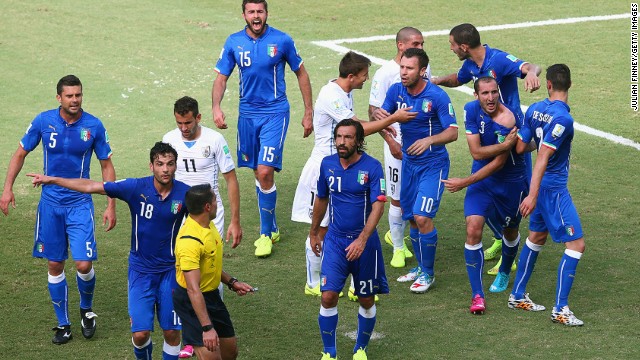 Players from both sides react after the incident. Chiellini later told Rai TV: "It was ridiculous not to send Suarez off. It is clear."