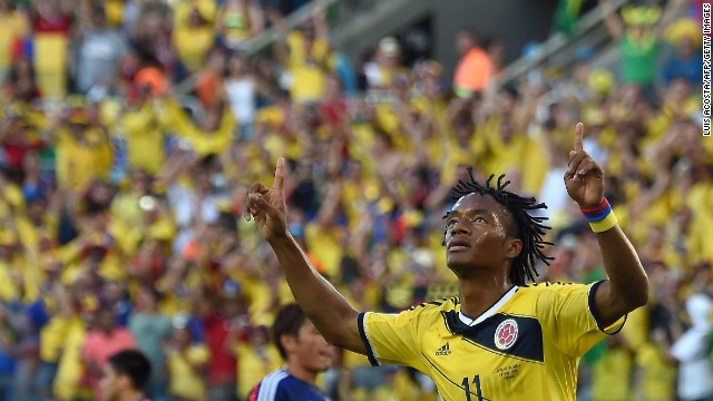 Colombia's Juan Guillermo Cuadrado celebrates after scoring a penalty.