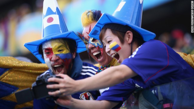 Colombia and Japan fans pose together for a selfie.