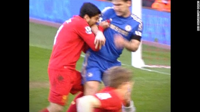 Suarez, left, was banned for 10 games in April 2013 after being found guilty of biting Chelsea defender Branislav Ivanovic during a English Premier League soccer match.