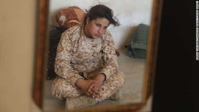 Female Peshmerga, or Kurdish warriors, between 18 and 45 years old form a special unit that is called to serve in any conditions. A soldier is pictured here on Wednesday, June 25. Vast swaths of northern Iraq, including the cities of Mosul and Tal Afar, have fallen as the Islamic State in Iraq and Syria, or ISIS, advances toward Baghdad, the capital. The ISIS militants want to establish a caliphate, or Islamic state, in the region, stretching from Iraq into northern Syria.