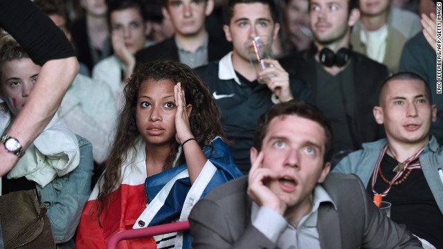 Spectators in Paris react as they watch the group-stage match between France and Ecuador on Wednesday, June 25. It ended 0-0.
