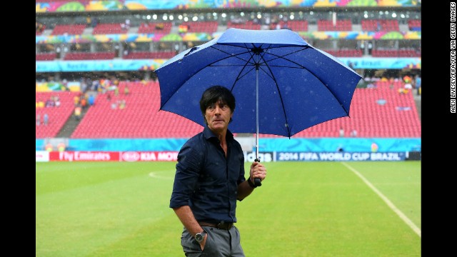 Germany head coach Joachim Loew checks the pitch condition before the game against the United States. 