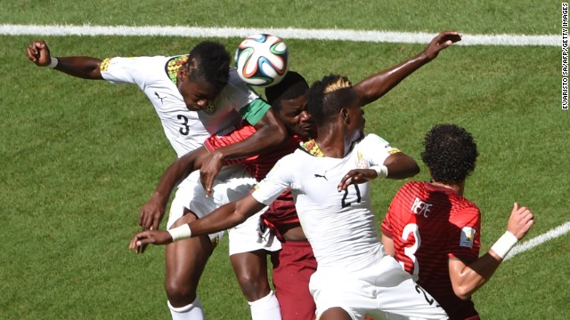Gyan, left, Portugal midfielder William Carvalho, Ghana defender John Boye and Pepe vie for the ball during the match between Portugal and Ghana.