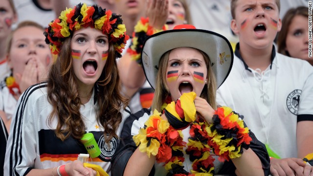 Two young fans of Germany watch the match against the United States.