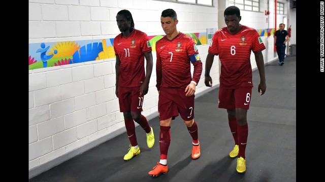 Eder, left, Ronaldo and William Carvalho of Portugal walk in the tunnel during halftime of the match between Portugal and Ghana.