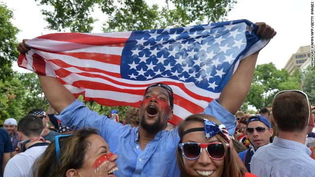 Fans celebrate from Dupont Circle in Washington on Thursday, June 26, after learning that the United States team, despite losing to Germany, advanced to the Round of 16 in the World Cup.