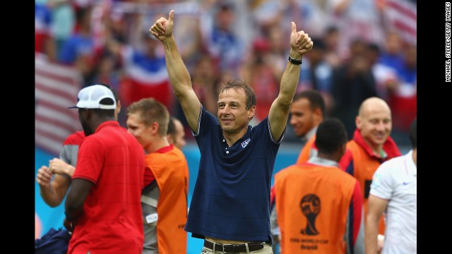 Head coach Jurgen Klinsmann of the United States acknowledges the fans after his team's 1-0 loss to Germany in Recife, Brazil. Despite the loss, the U.S. team advances to the round of 16 in the 2014 World Cup.