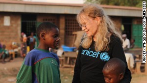 Mia Farrow meets brothers Oumarou and Adamou Bouba, 13 and 10, at the Bossangoa camp 