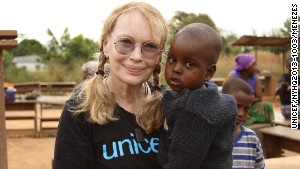 Mia Farrow carries Moussa Ibrahim at the Bossangoa camp in the Central African Republic