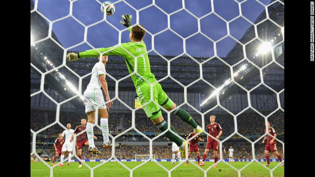 Igor Akinfeev of Russia makes a save against Algeria.