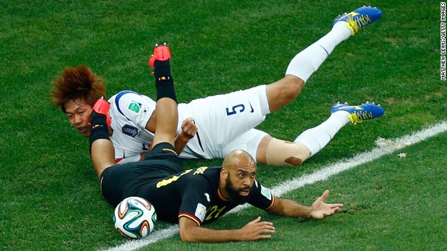 South Korea defender Kim Young-Gwon and Anthony Vanden Borre of Belgium collide during the match between South Korea and Belgium on June 26 in Sao Paulo, Brazil. 