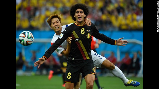 Young-Gwon, left, vies with Belgium midfielder Marouane Fellaini. 