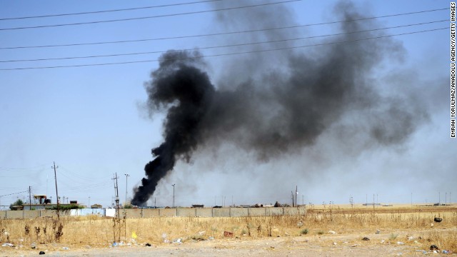 Smoke rises in the Karakus district of Mosul as clashes between Iraqi forces and ISIS militants take place on June 26.