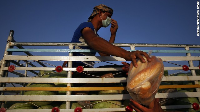 Food is handed out at the displacement camp in Khazair.