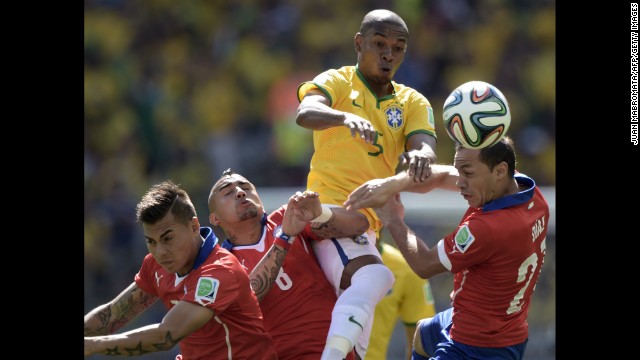 From left: Chile's Eduardo Vargas, Chile's Arturo Vidal, Brazil's Marcelo and Chile's Marcelo Diaz vie for the ball.