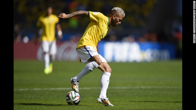 Brazilian defender Dani Alves controls the ball.