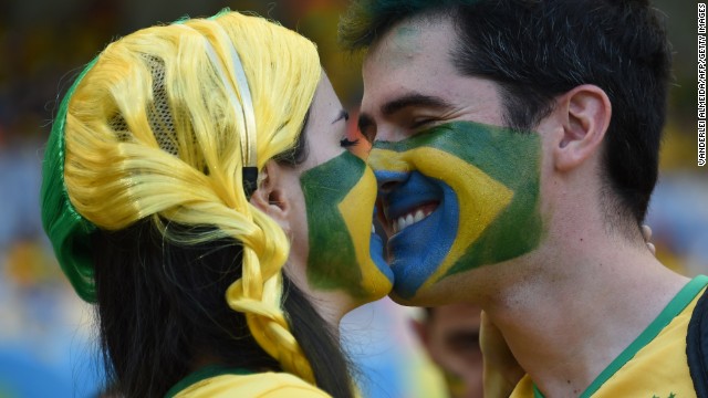 Brazil fans kiss before the start of the game. <a href='http://www.cnn.com/2014/06/26/football/gallery/world-cup-0626/index.html' target='_blank'>See the best World Cup photos from June 26</a>.