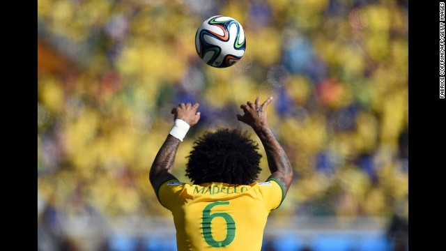 Brazil's defender Marcelo throws the ball in during the game.
