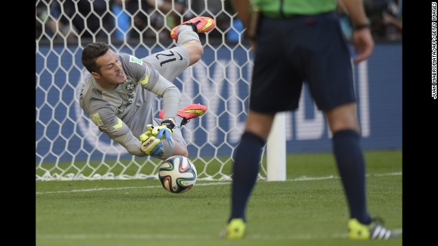 Brazil's goalkeeper Julio Cesar makes a save during the penalty shootout.