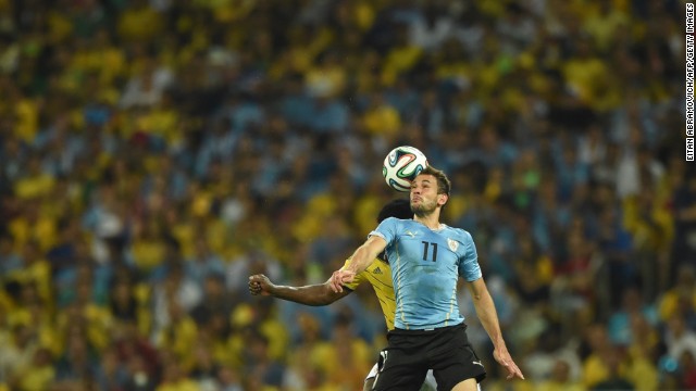 Uruguay's forward Christian Stuani heads the ball.