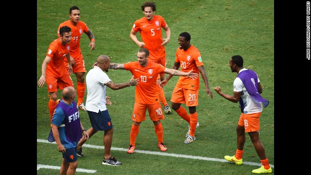 Wesley Sneijder of the Netherlands (No. 10) celebrates scoring his team's first goal against Mexico.