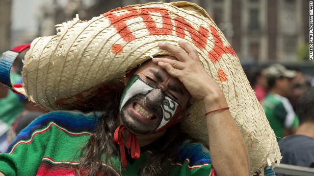 A Mexico fan shows his dejection at Zocalo Square in Mexico City after the national team lost to the Netherlands 2-1 in a round-of-16 match Sunday, June 29. 