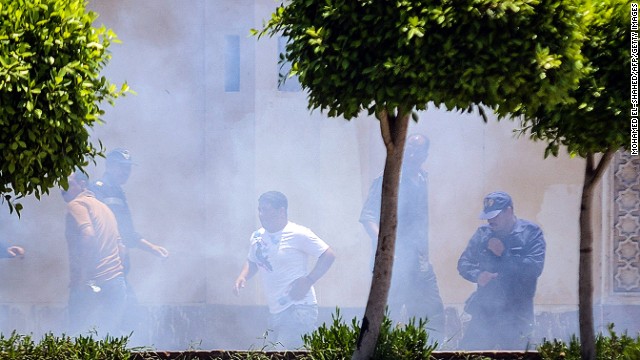 Smoke billows moments after a bomb blast in the vicinity of the Ittihadiya Palace in Cairo, on June 30, 2014. 