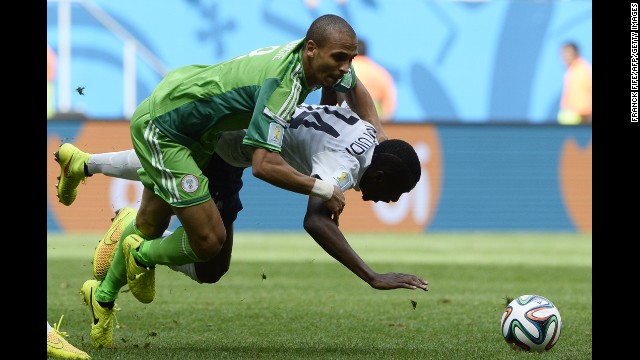 Nigerian forward Peter Odemwingie, left, challenges Blaise Matuidi of France.