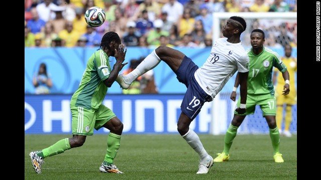 Pogba reaches for the ball near Nigeria's Victor Moses.