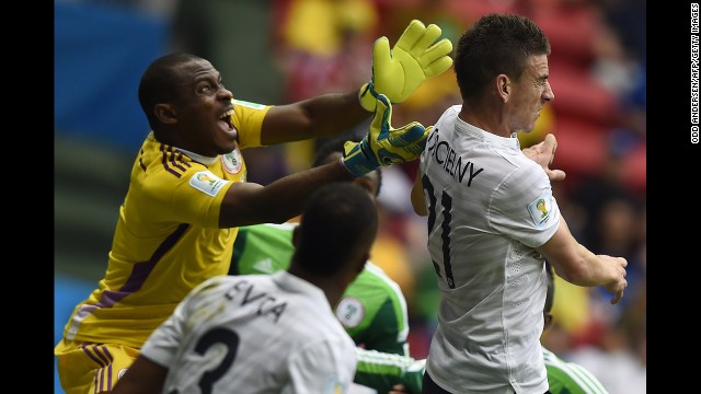 Koscielny and Enyeama compete for the ball.
