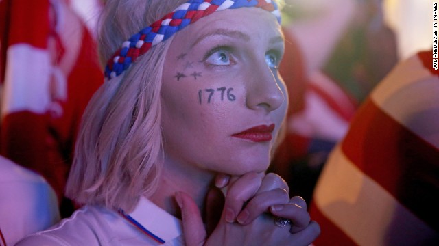 A U.S. fan watches nervously as the Americans surprisingly emerge from the group stage despite a nail-biting defeat against Germany.