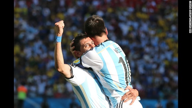 Argentina's Angel Di Maria, left, celebrates the winning goal with teammate Lionel Messi.