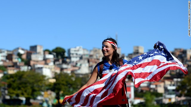 A U.S. fan in Salvador holds her flag ahead of the match on July 1.