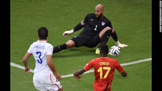 Howard makes a save on Origi in the first minute of the match.
