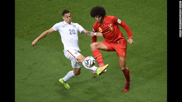 Fellaini and Cameron compete for the ball in the first half.