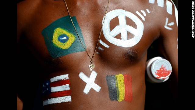 A fan with a painted chest enjoys the festivities before the U.S.-Belgium match.