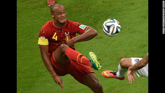 Kompany plays the ball during the first half.