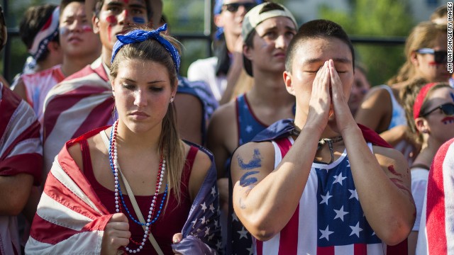 Fans in Washington react to the United States' loss to Belgium on July 1.