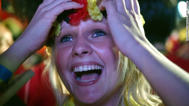 A Belgium fan reacts as she watches the round-of-16 match between Belgium and the United States from a FIFA Fan Fest viewing in Rio de Janeiro on Tuesday, July 1. Belgium won the match 2-1 in extra time. 