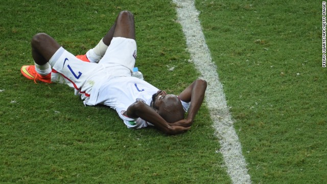 U.S. defender DaMarcus Beasley lies on the ground after the match.