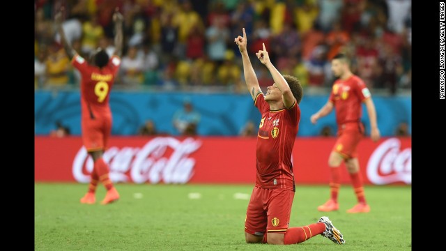 Belgian midfielder Axel Witsel, foreground, celebrates his team's victory.