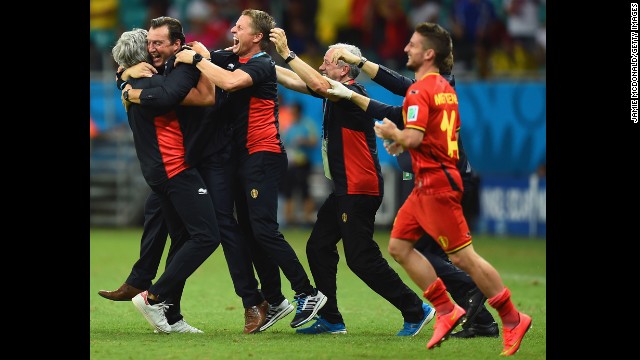 Head coach Marc Wilmots of Belgium, second from left, celebrates after defeating the United States.