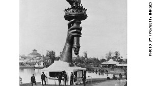 The forearm and torch of the Statue of Liberty on display at the Centennial Exposition in Philadelphia, 1876. To raise funds for the completion of the statue and its pedestal, members of the public could pay 50 cents to climb to the balcony of the torch.