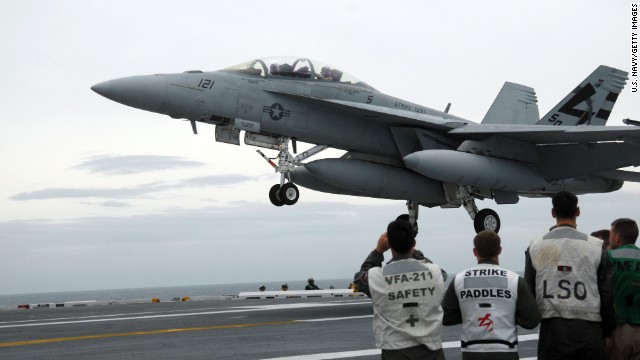 An F/A-18 Hornet is pictured aboard the USS George H.W. Bush on May 19, 2009. Two F/A-18s from the Bush struck ISIS artillery in Iraq on Friday, August 8. The F/A-18 Hornet, a late-'70s contemporary of the Air Force's F-16 Fighting Falcon, became the workhorse of U.S. carrier-based air power, and still supplements the Navy's and Marines' more current fleet of F/A-18E and F/A-18F Super Hornets. It is designed as both a fighter and attack aircraft.